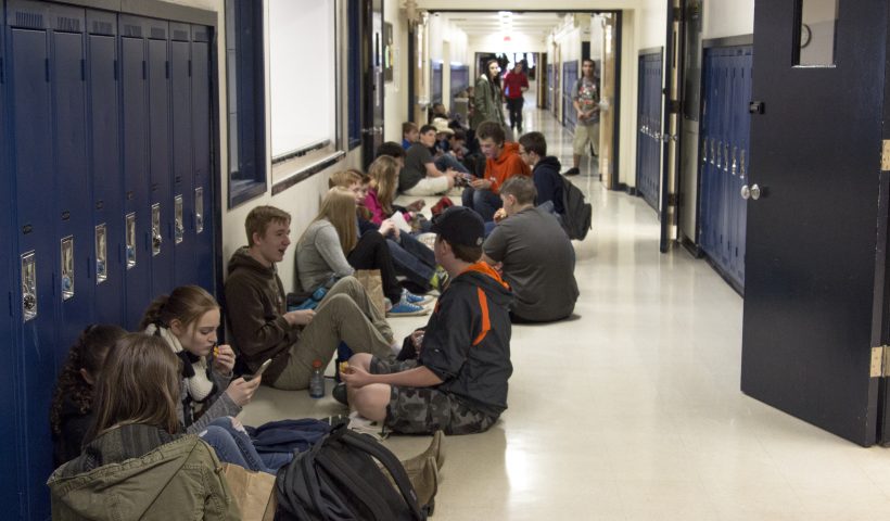 Kids eating in school hallway