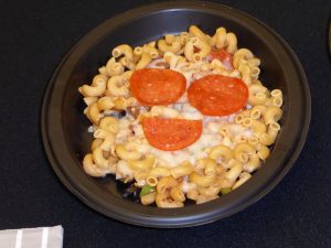 Macaroni and cheese with pepperoni on top