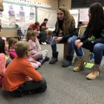 SAHS leadership students reading their children's stories to Oak Elementary students.