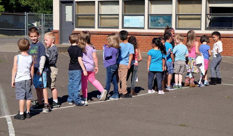 Children lined up on playground