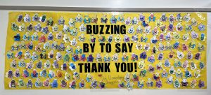 Oak Elementary Stingers poster recognizing the 2022-23 school board. The poster with bees says "Buzzing by to say thank you!"